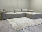 Ivory modular cinema sofa with removable footstool in a modern living room setting