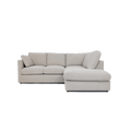 Modern cream right corner sofa with plush cushions and chaise lounge, isolated on white background