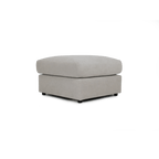 Cream fabric ottoman footstool with modern, boxy design on a white background