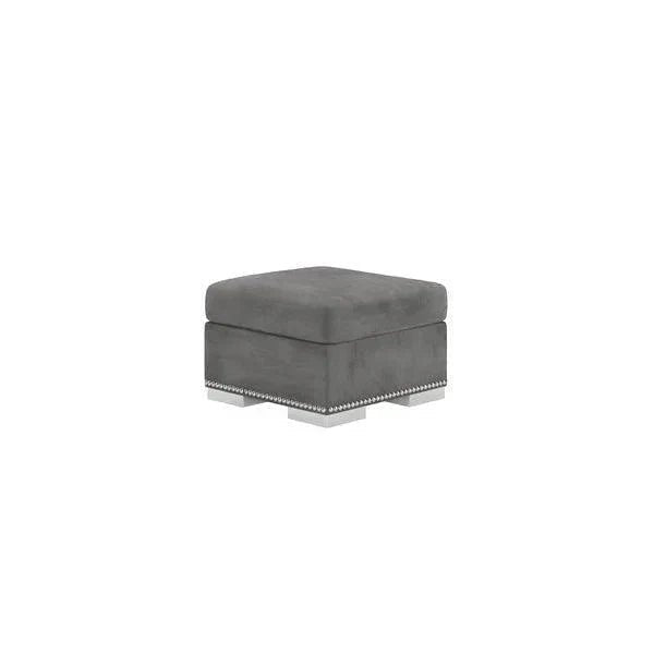 Square silver fabric footstool with chrome legs and studded trim on white background