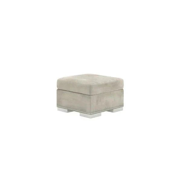 Silver velvet square footstool with studded trim and low legs on white background