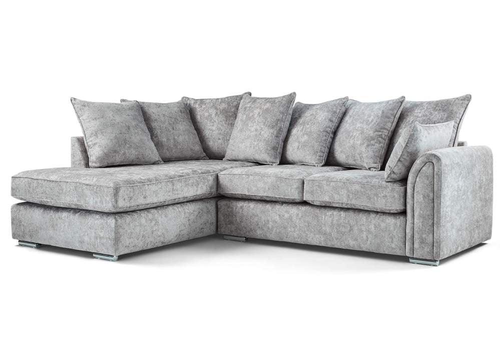 Modern grey corner sofa with chaise lounge and plush cushions on white background