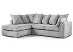 Modern grey corner sofa with chaise lounge and plush cushions on white background