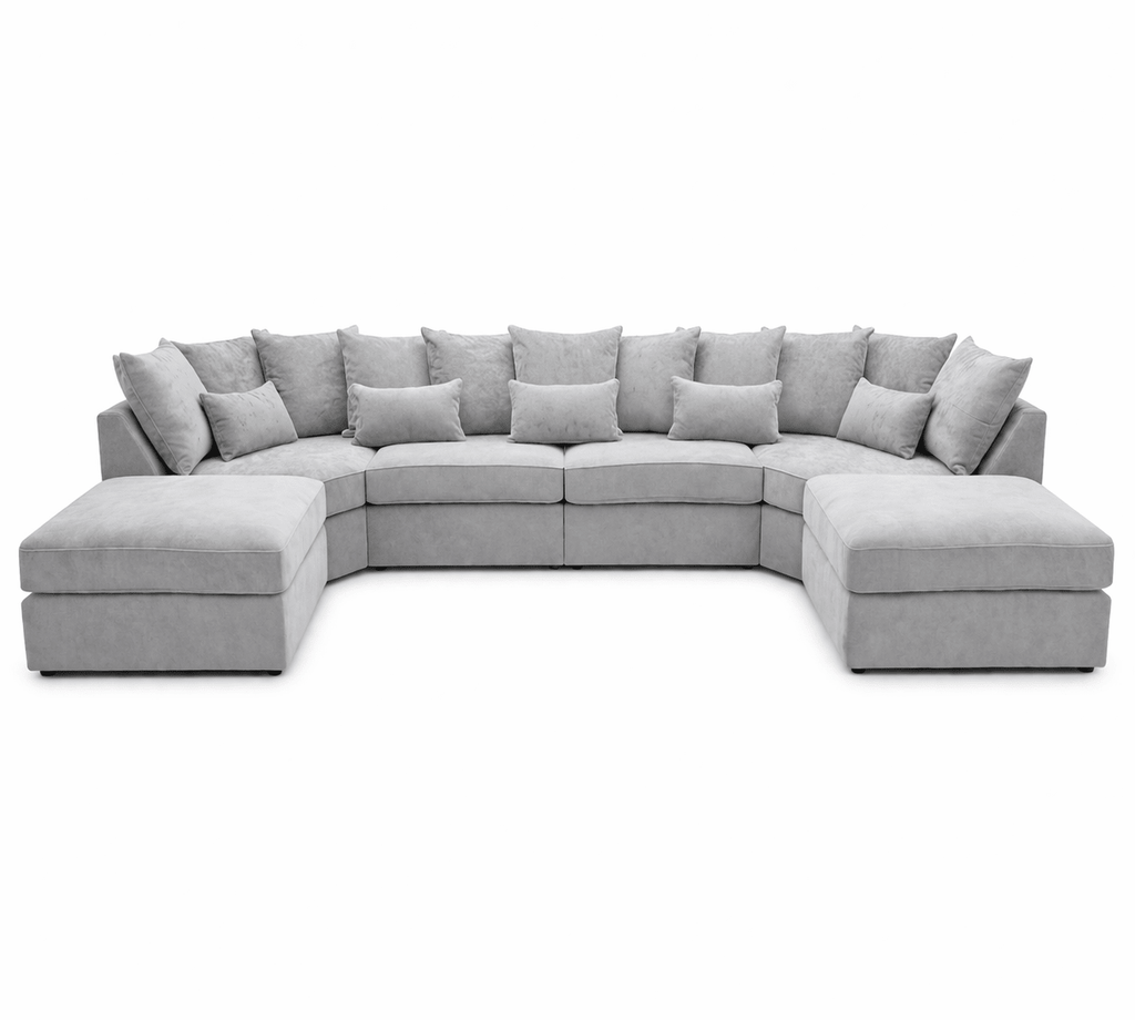 Large U-shaped grey sectional sofa with plush cushions on a white background