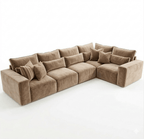Five-piece tan modular corner sofa with plush cushions and pillows on white background