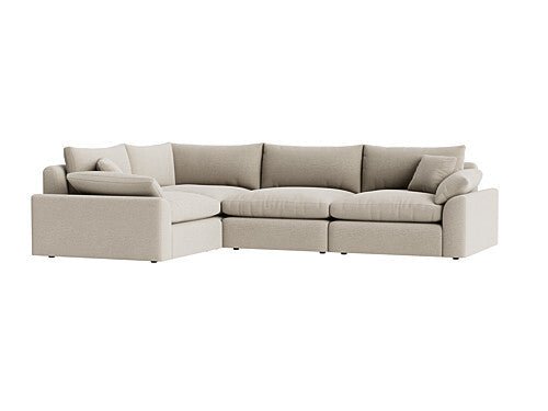 Beige modular corner sofa with plush cushions and a contemporary design, isolated on white