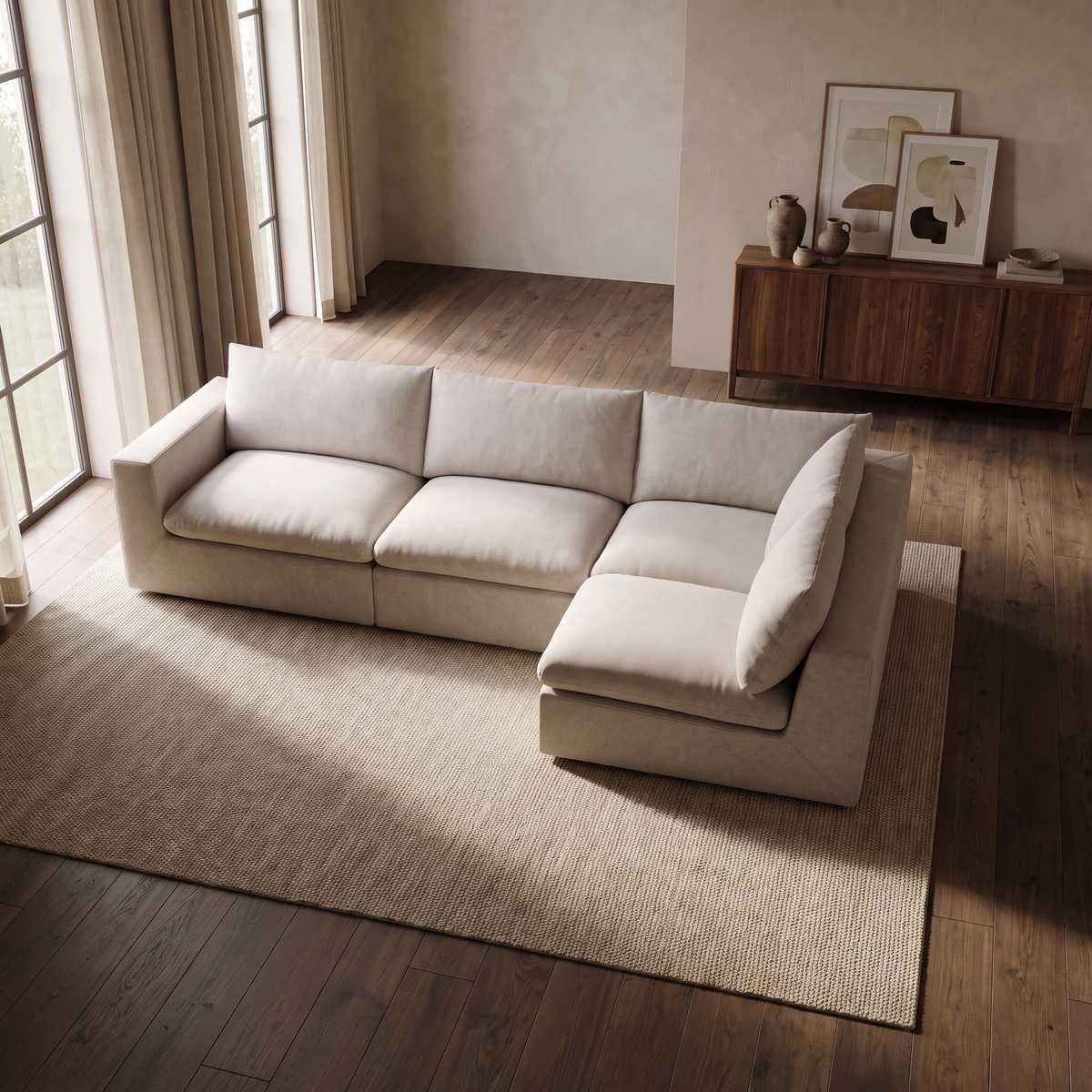 Nuvola Feather-Filled Open Corner Sofa — elevated camera view in a warm stone and walnut living room