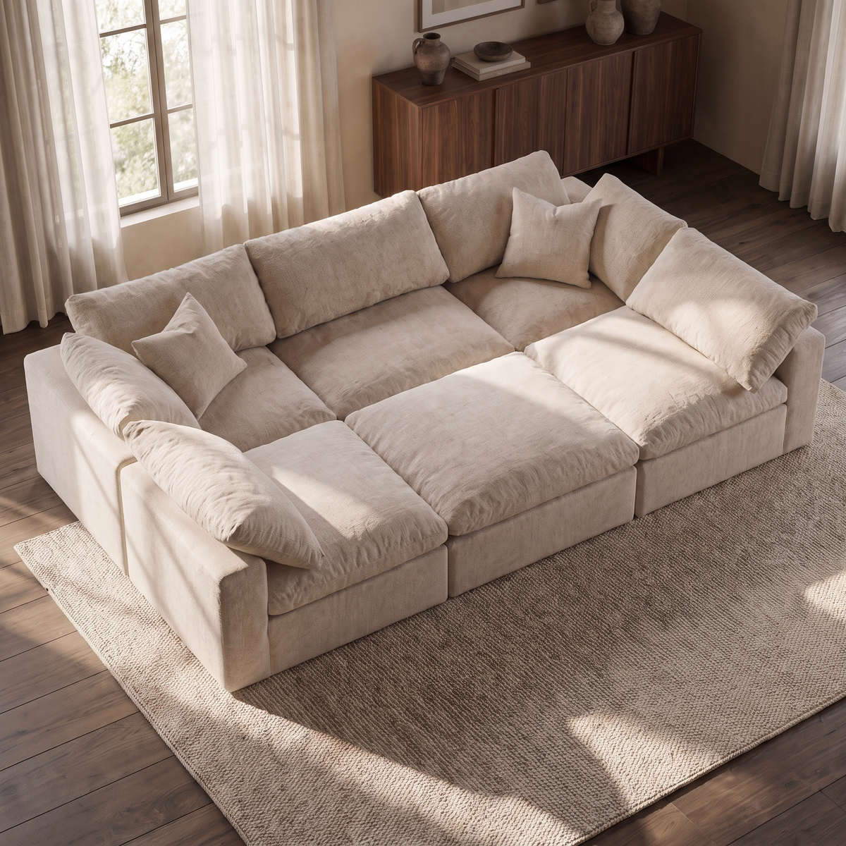 Nuvola Pit-Sectional Feather Cinema Sofa — elevated camera view in a warm stone and walnut living room