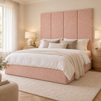 Four Powder Teddy 45cm wall panels behind a matching upholstered bed base in a styled bedroom. Room visualisation; panels sold individually, base and styling separate.