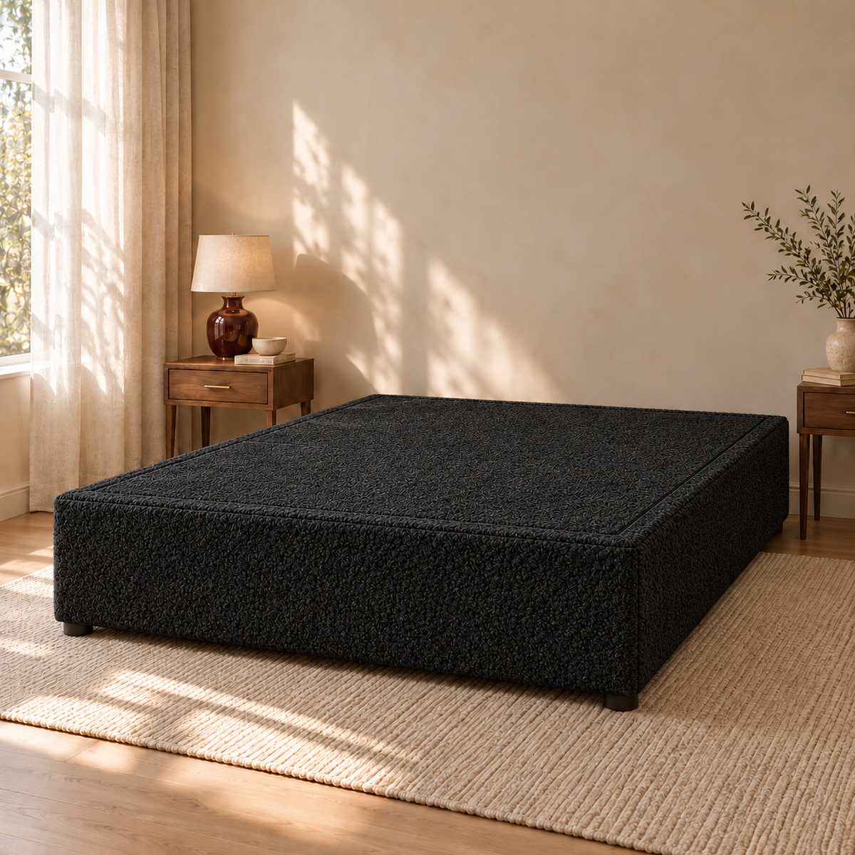 Black Teddy Bouclé non-storage divan bed base in a styled bedroom. Base only; fabric colour visualisation.