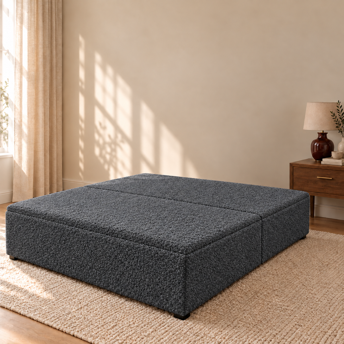 Granite Teddy Bouclé ottoman storage bed base shown closed in a styled bedroom. Base only; fabric colour visualisation.