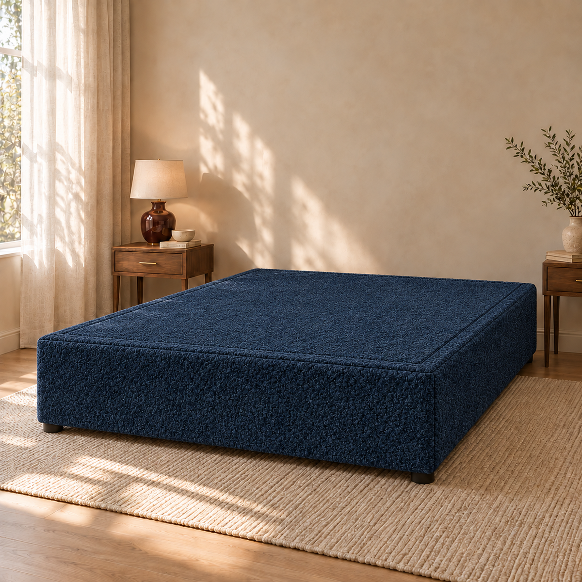 Ink Teddy Bouclé non-storage divan bed base in a styled bedroom. Base only; fabric colour visualisation.