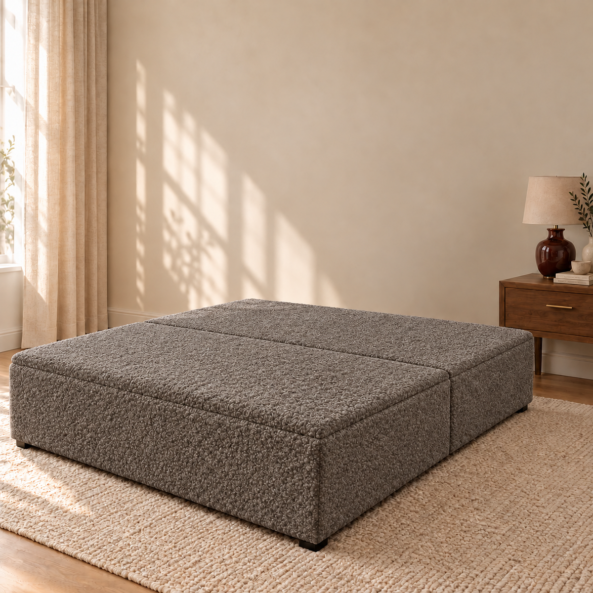 Pebble Teddy Bouclé ottoman storage bed base shown closed in a styled bedroom. Base only; fabric colour visualisation.