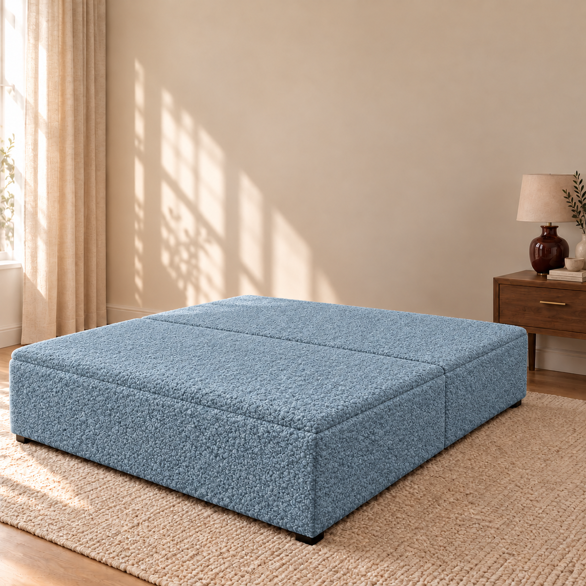 Sky Teddy Bouclé ottoman storage bed base shown closed in a styled bedroom. Base only; fabric colour visualisation.