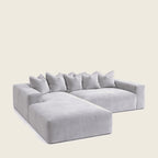 Luxury grey velvet sectional sofa with chaise and plush cushions, ideal for modern living rooms