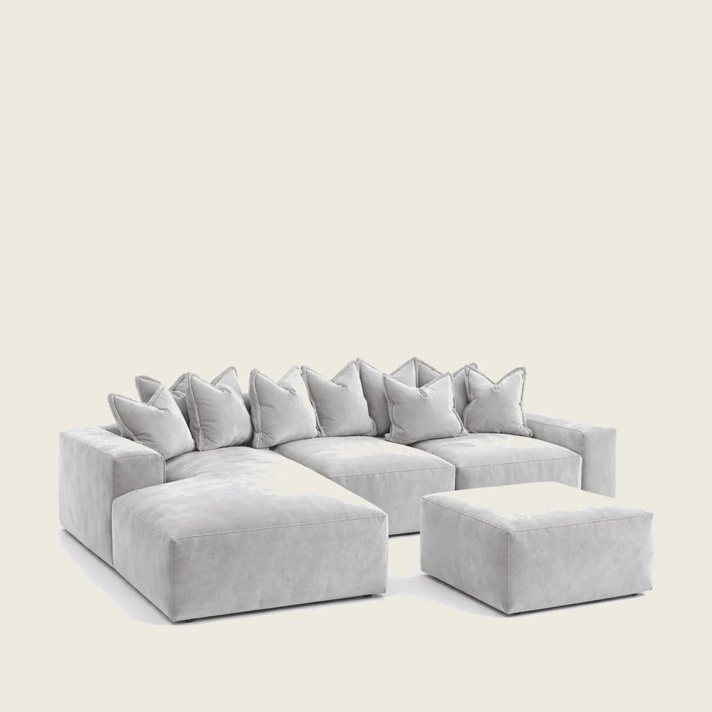 Luxury gray sectional sofa with plush cushions and matching ottoman for modern living rooms