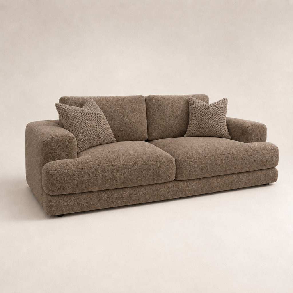 Aurelia 3 Seater Sofa in Coffee on a clean stone studio background