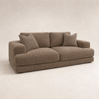 Aurelia 3 Seater Sofa in Coffee on a clean stone studio background