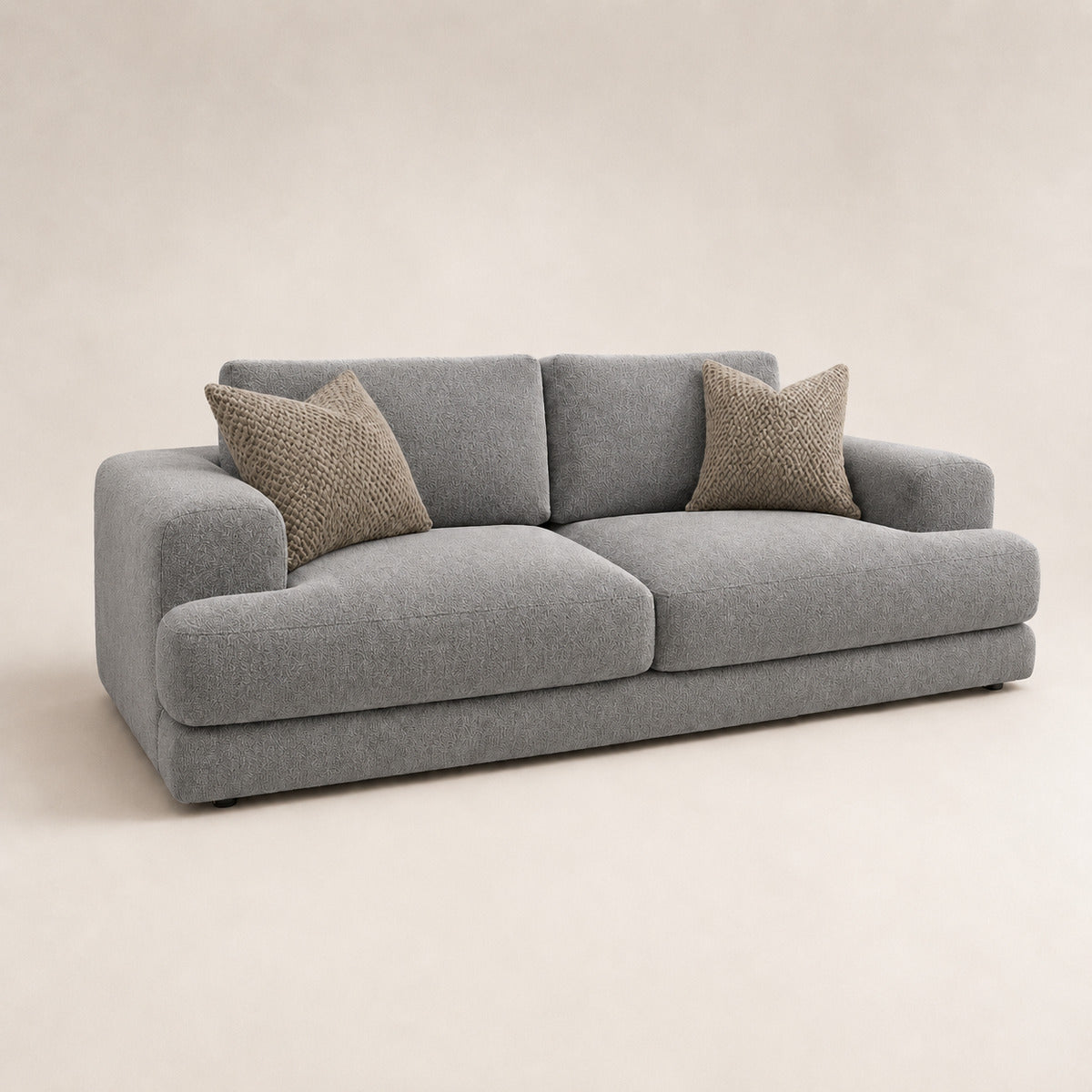 Aurelia 3 Seater Sofa in Luxe Steel Grey on a clean stone studio background