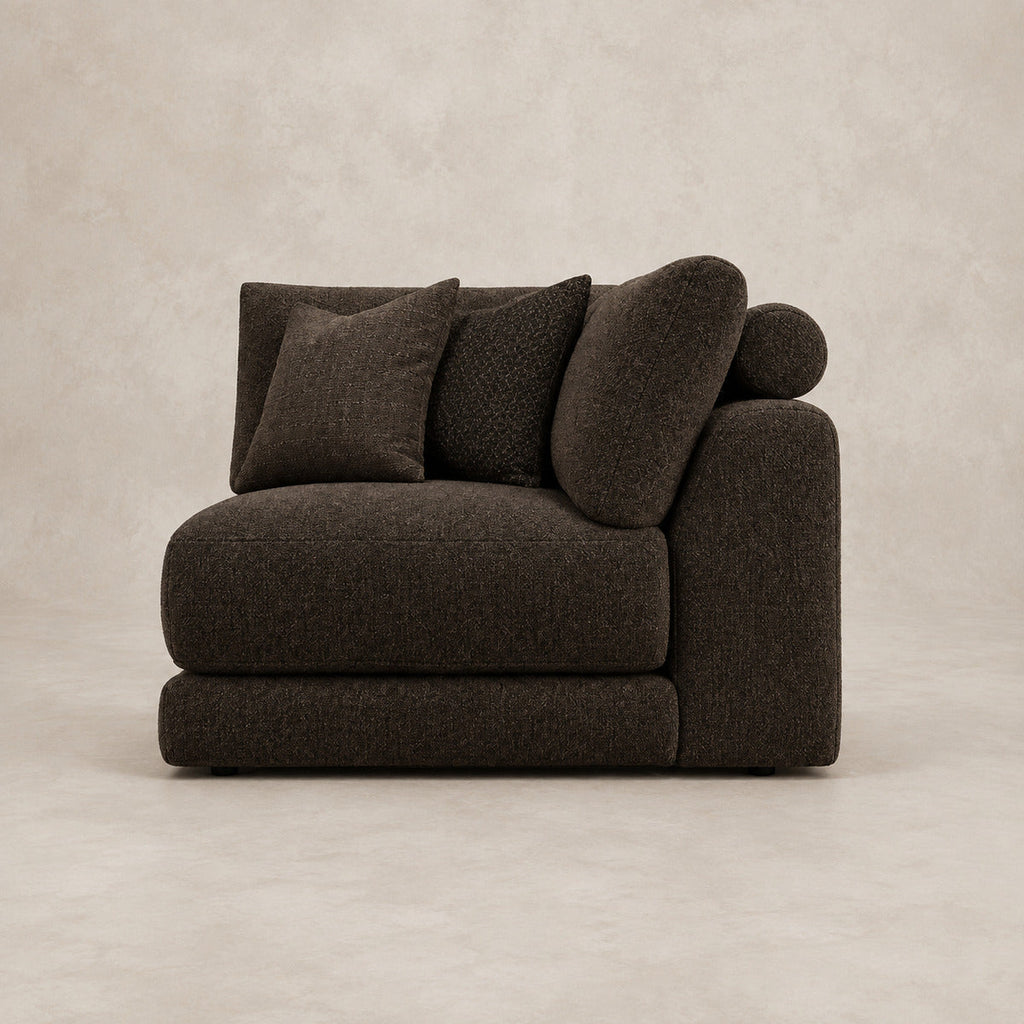 Aurelia Corner Module in Double Espresso on a clean stone studio background