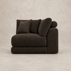 Aurelia Corner Module in Double Espresso on a clean stone studio background