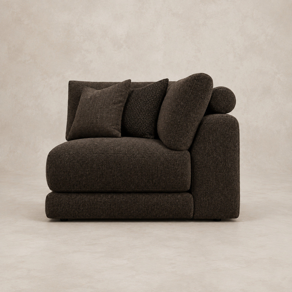 Aurelia Corner Module in Double Espresso on a clean stone studio background