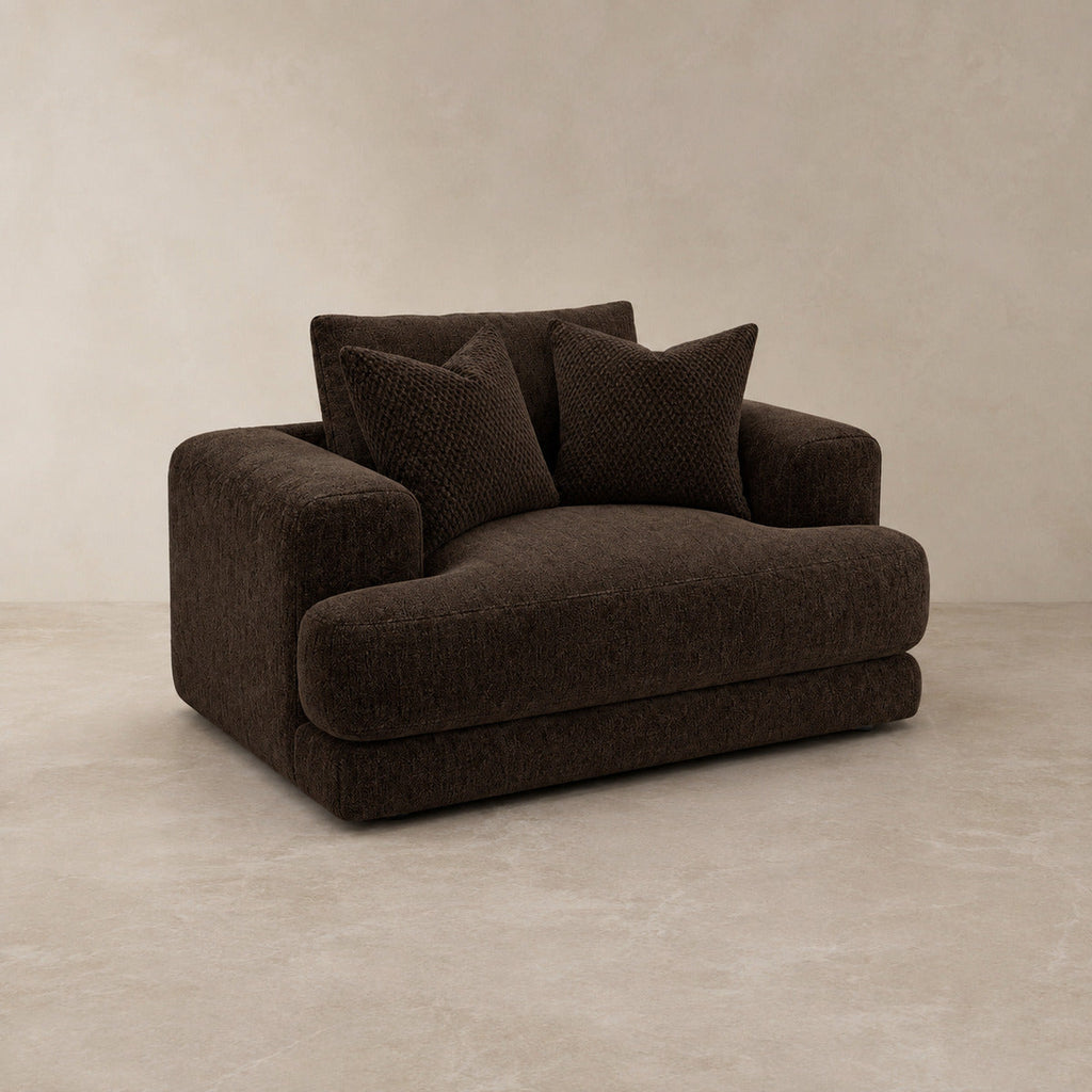 Aurelia Cuddler Love Seat in Double Espresso on a clean stone studio background