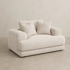 Aurelia Cuddler Love Seat in Summer Beach on a clean stone studio background