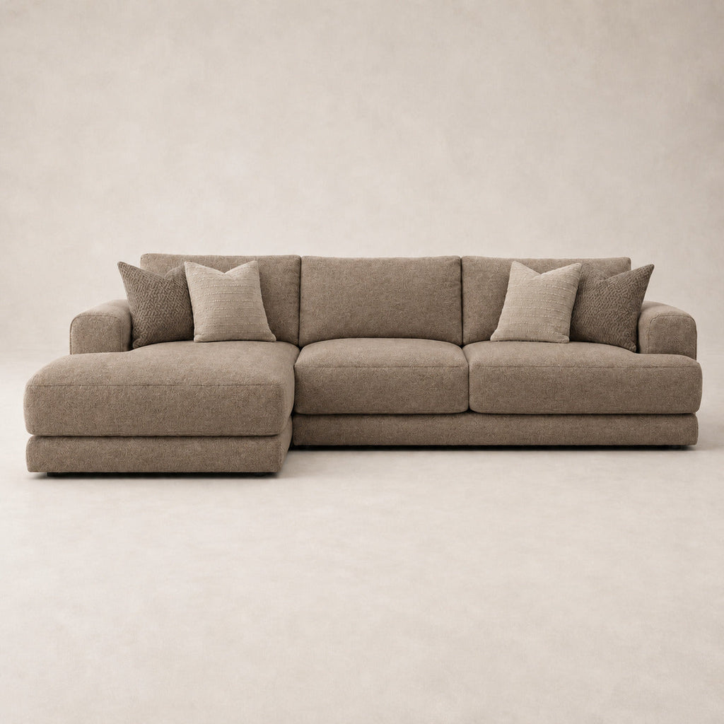 Aurelia Large Chaise Sofa in Coffee on a clean stone studio background