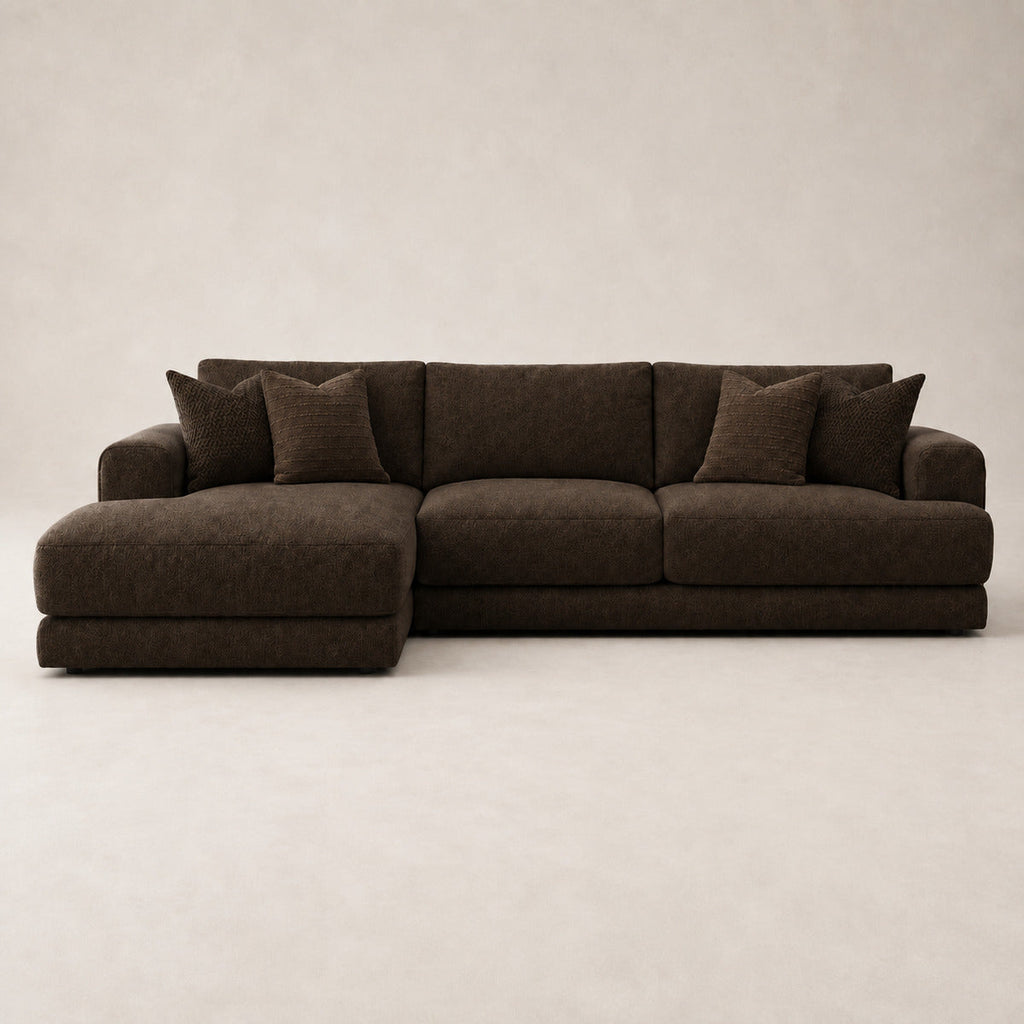 Aurelia Large Chaise Sofa in Double Espresso on a clean stone studio background