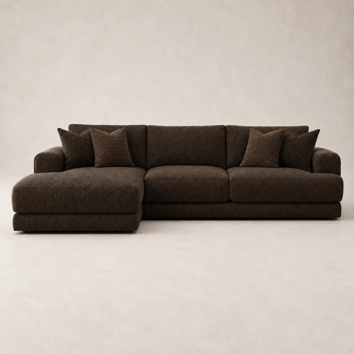 Aurelia Large Chaise Sofa in Double Espresso on a clean stone studio background