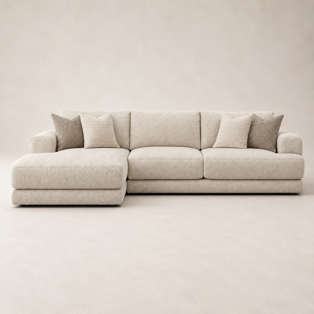 Aurelia Large Chaise Sofa in Summer Beach on a clean stone studio background