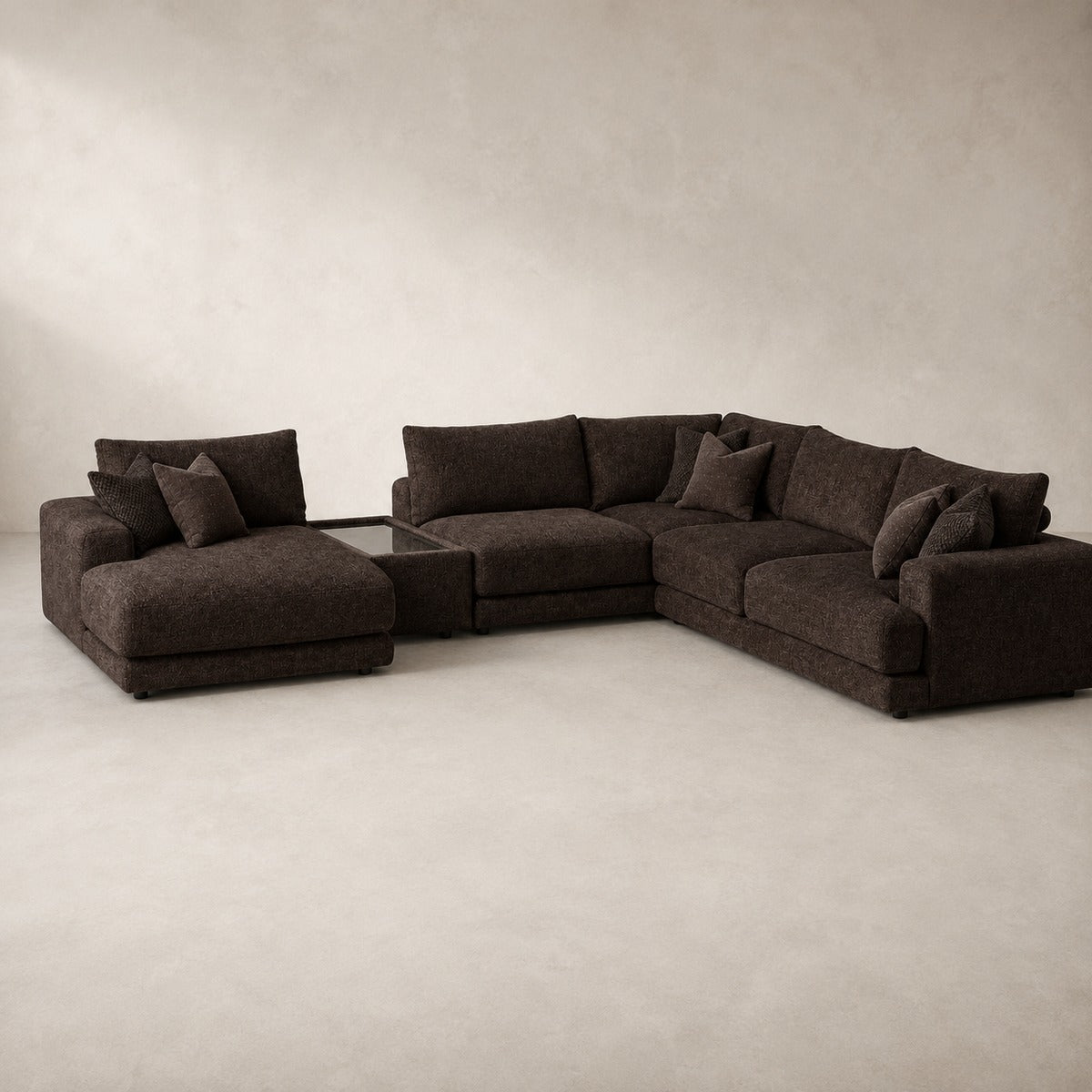 Aurelia Large Chaise Sofa & Glass-Top Table Set in Double Espresso on a clean stone studio background