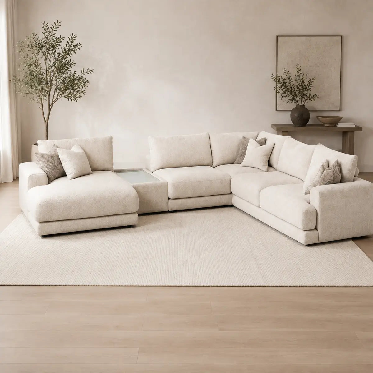 Aurelia Large Chaise Sofa & Glass-Top Table Set styled in a realistic premium living space