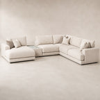 Aurelia Large Chaise Sofa & Glass-Top Table Set in Summer Beach on a clean stone studio background