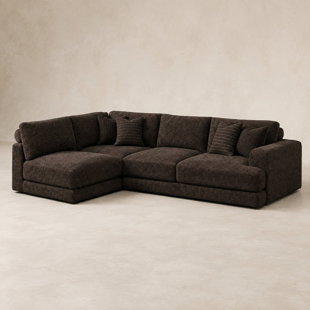 Aurelia Large Corner Sofa in Double Espresso on a clean stone studio background