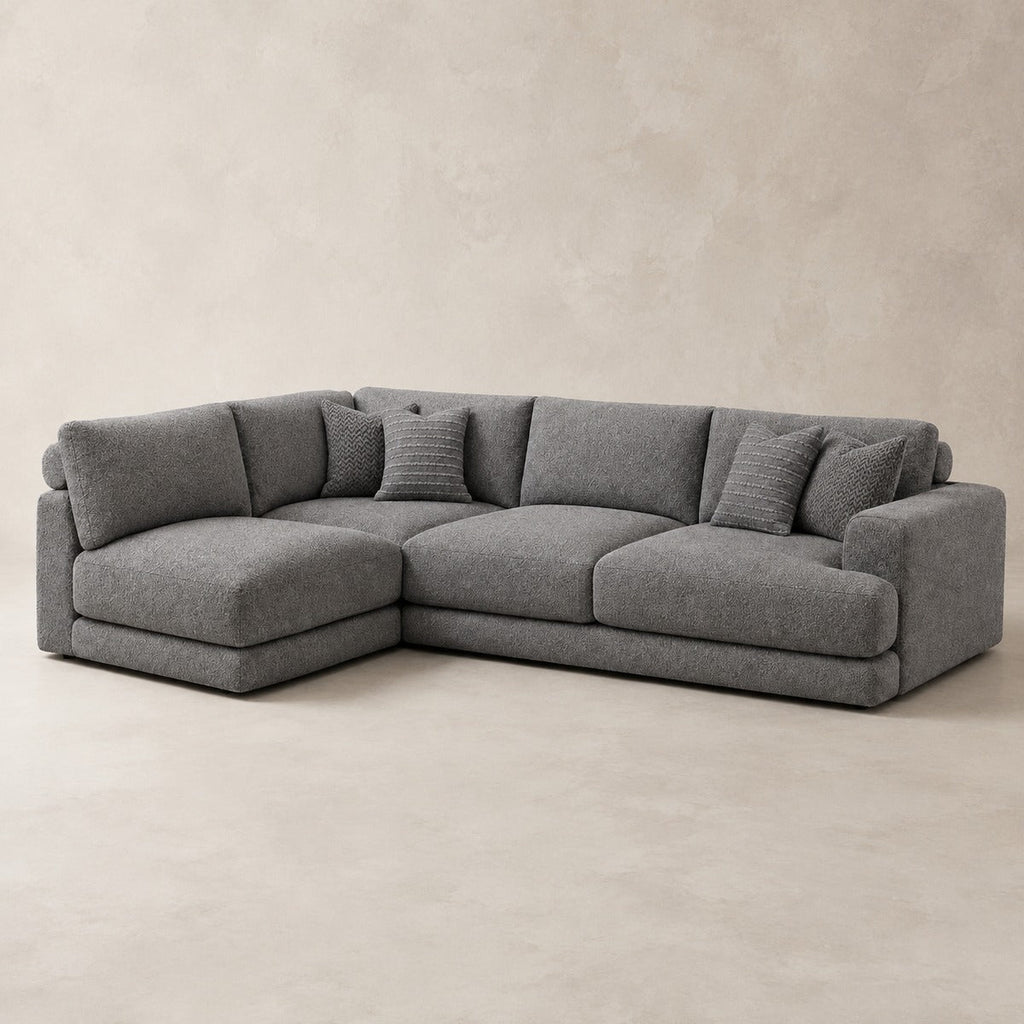 Aurelia Large Corner Sofa in Luxe Steel Grey on a clean stone studio background