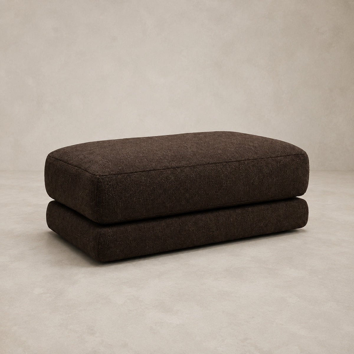 Aurelia Large Footstool in Double Espresso on a clean stone studio background