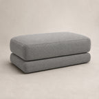 Aurelia Large Footstool in Luxe Steel Grey on a clean stone studio background