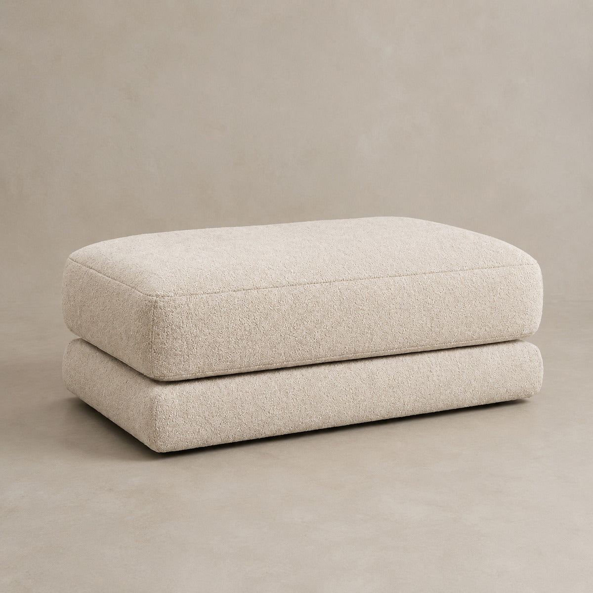 Aurelia Large Footstool in Summer Beach on a clean stone studio background