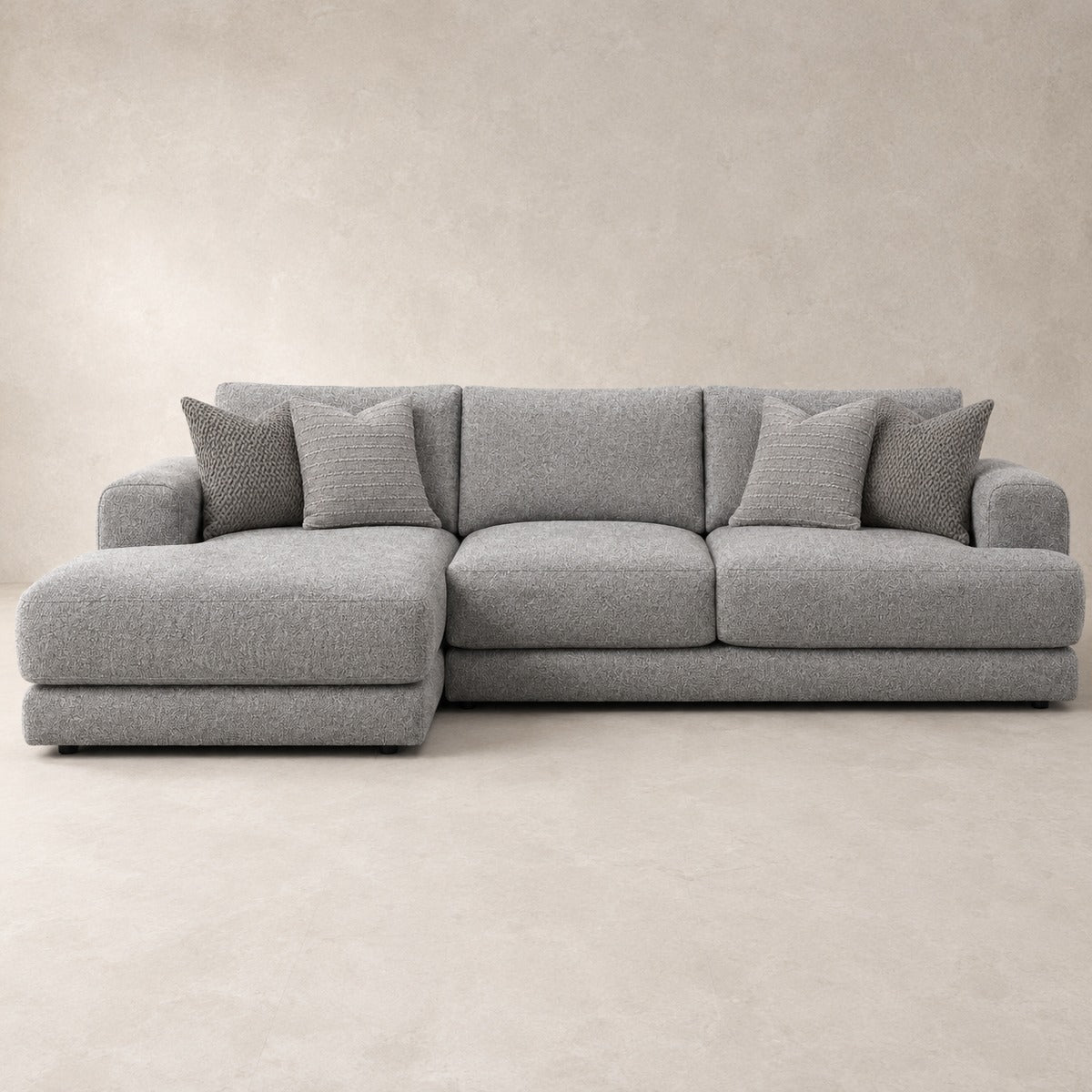 Aurelia Medium Chaise Sofa in Luxe Steel Grey on a clean stone studio background