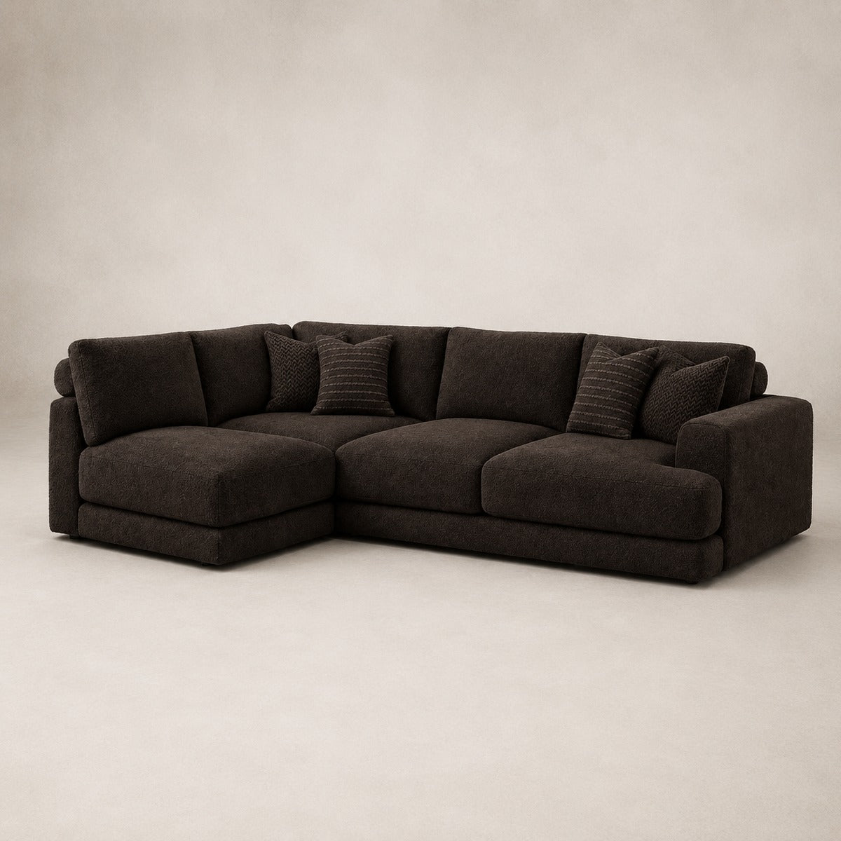 Aurelia Medium Corner Sofa in Double Espresso on a clean stone studio background