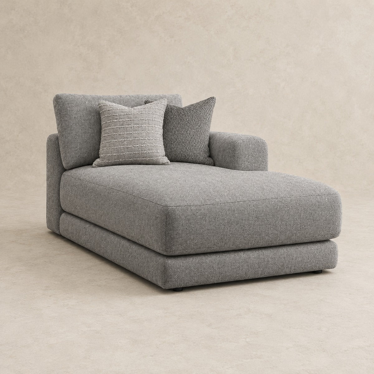 Aurelia One-Arm Chaise Module in Luxe Steel Grey on a clean stone studio background