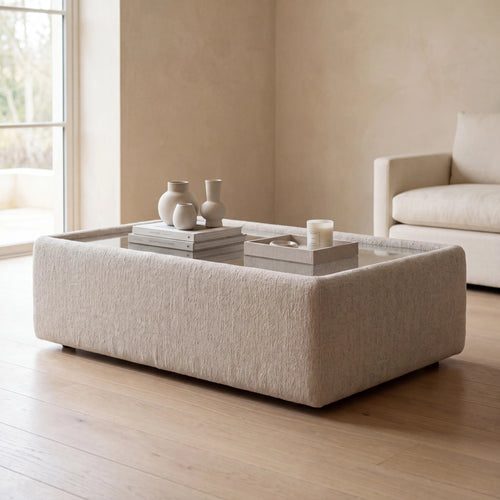 Aurelia Upholstered Rectangle Glass-Top Table styled in a realistic premium living space