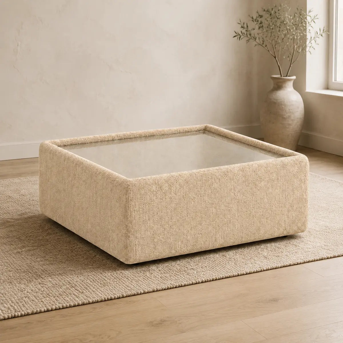 Aurelia Upholstered Square Glass-Top Table styled in a realistic premium living space
