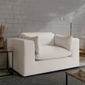 Modern white textured sofa with plush cushions against brick wall, luxury living room furniture