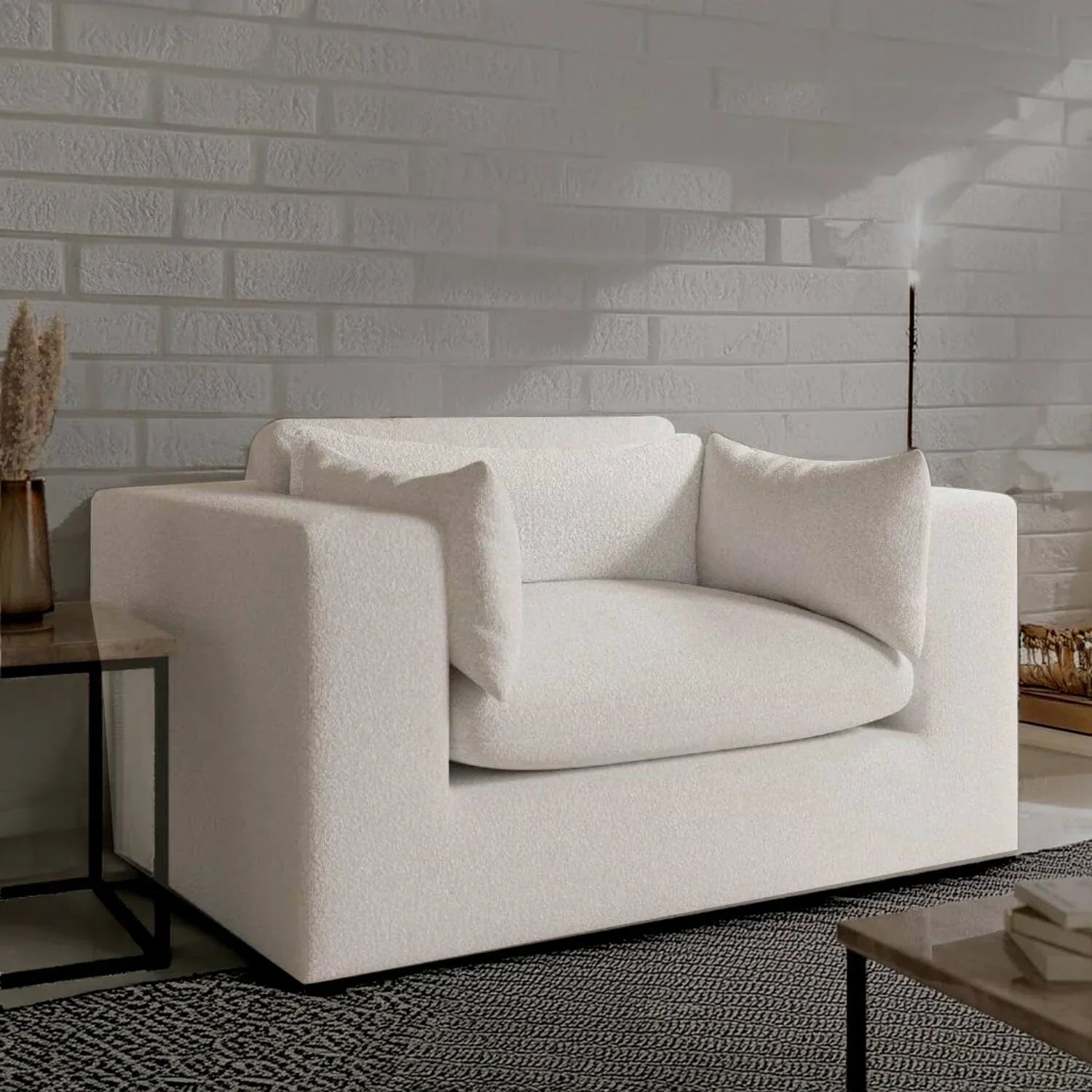 Modern white textured sofa with plush cushions against brick wall, luxury living room furniture