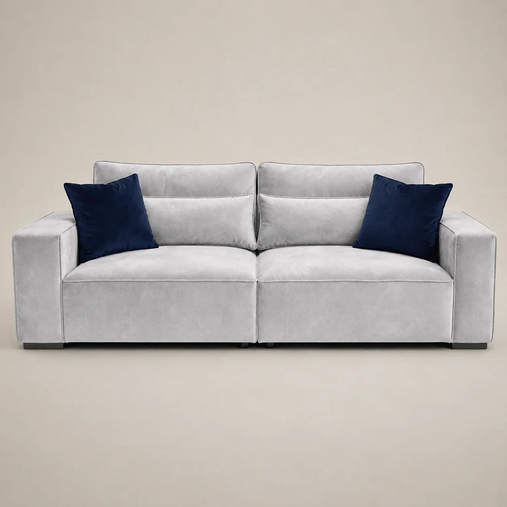 Luxury gray velvet sofa with navy blue cushions, modern design for living room comfort