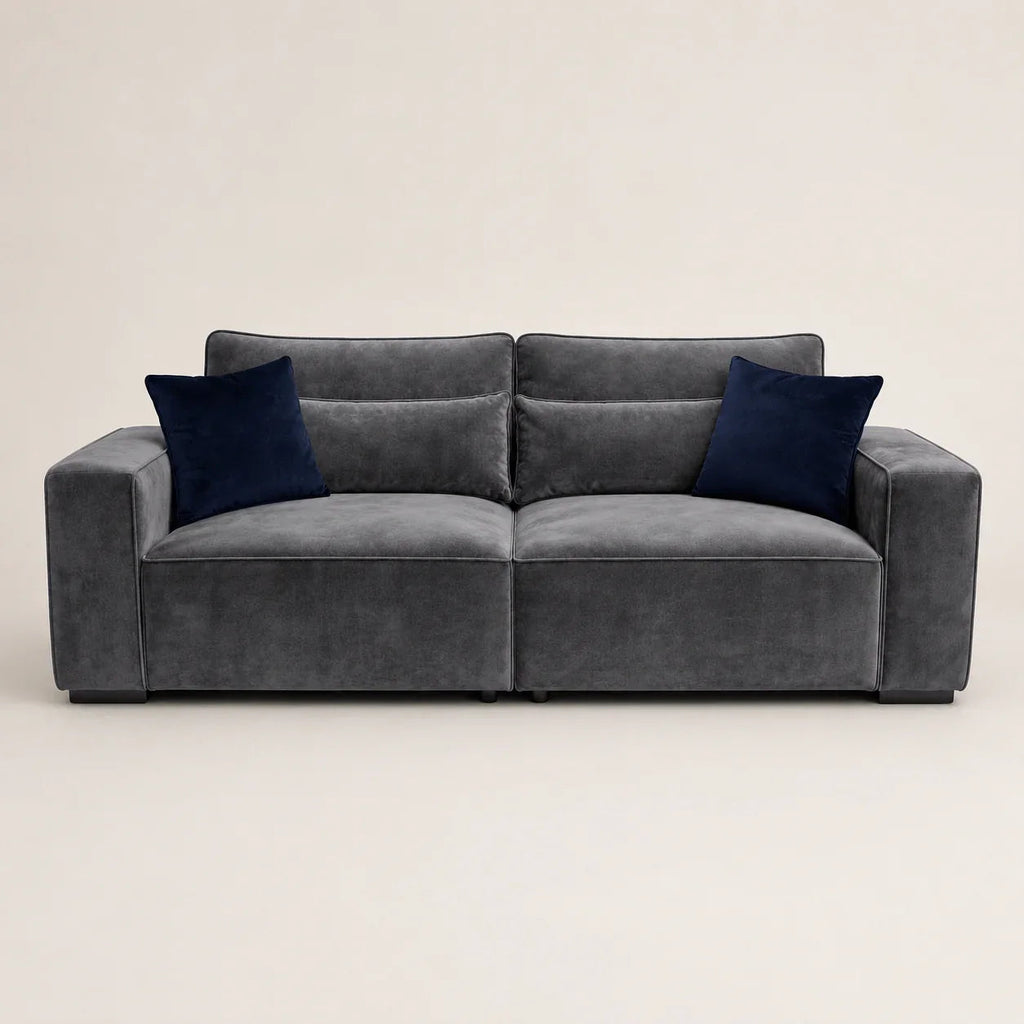 Luxury grey velvet sofa with navy blue cushions, modern design for living room comfort