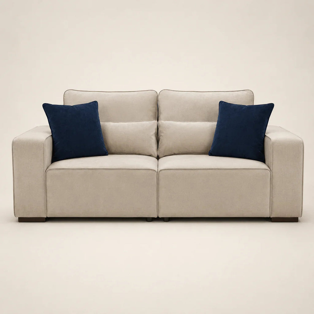 Beige luxury sofa with navy blue velvet cushions, modern design for living room comfort